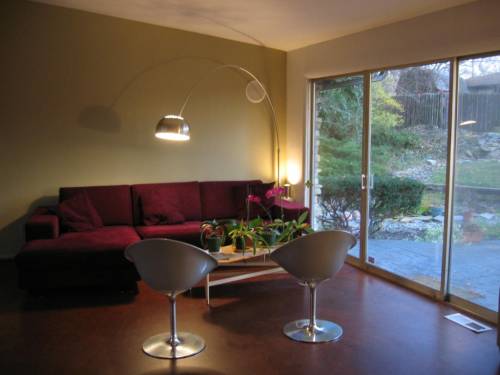 Upper living room (back half) with triple slider to backyard patio