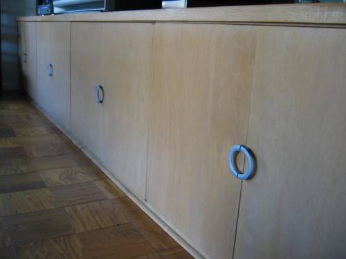 Living area downstairs; detail of built-in storage cabinets